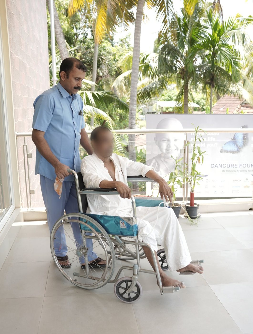 A caregiver taking a resident out in a wheelchair
